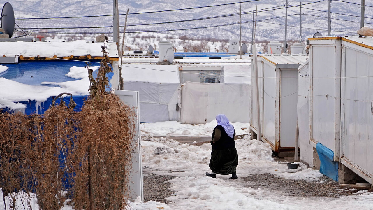 A picture shows a snow-covered displacement camp for Yazidis in the area of Dawudya, about 60 kilometers (37 miles) north of Dahuk, Iraqi Kurdistan, Jan. 25, 2022.