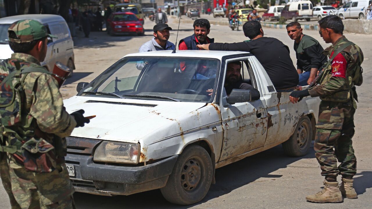 Turkish-backed policemen man a checkpoint in the northwestern Syrian city of Afrin on March 31, 2018.