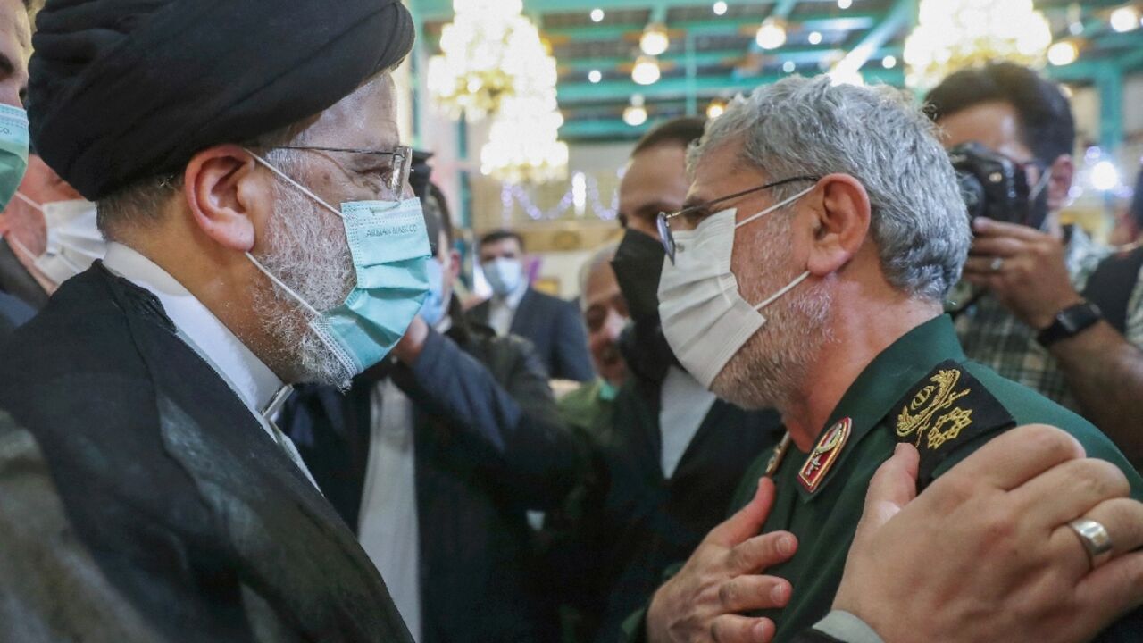 Iran's President Ebrahim Raisi (L) greets the head of the Revolutionary Guards' Quds Force Brigadier General Esmail Qaani at a Tehran ceremony to honour the families of those killed in the 1980-1988 Iran-Iraq war and veterans of that conflict Iran's President Ebrahim Raisi (L) greets the head of the Revolutionary Guards' Quds Force Brigadier General Esmail Qaani at a Tehran ceremony to honour the families of those killed in the 1980-1988 Iran-Iraq war and veterans of that conflict