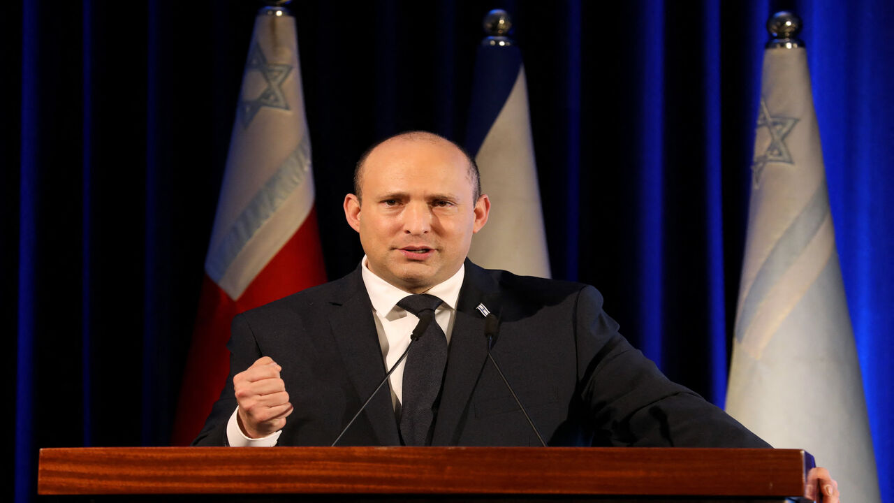 Israeli Prime Minister Naftali Bennett gives a speech during a ceremony for the Jewish holiday of Hanukkah for Israeli soldiers, Jerusalem, Nov. 29, 2021.