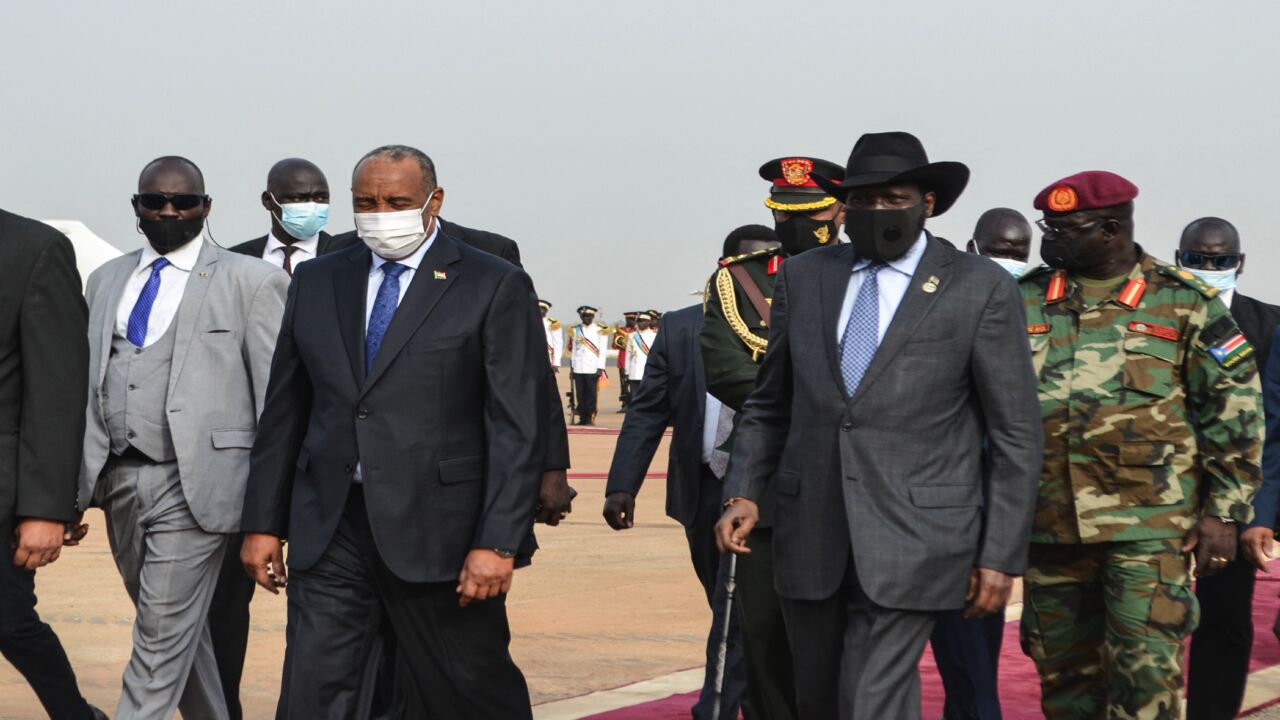 South Sudan's President Salva Kiir (2nd R) walks with Sudan's Sovereign Council Chief Gen. Abdel Fattah al-Burhan (2nd L).