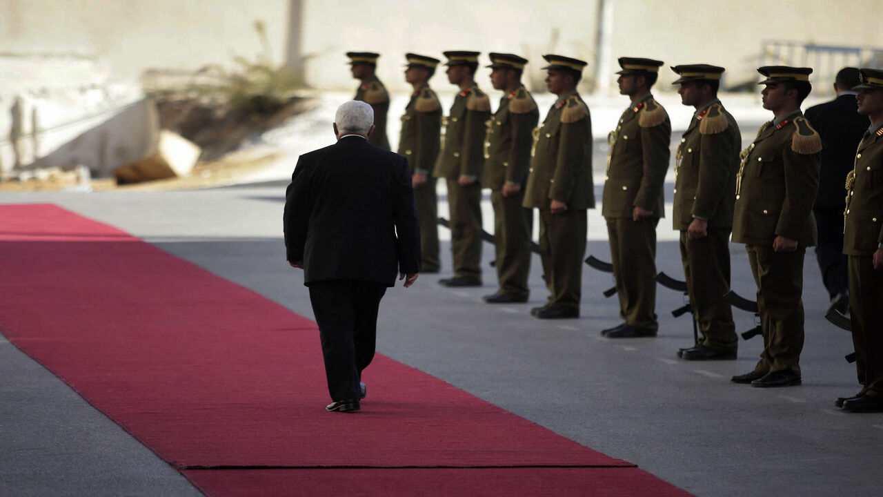 Palestinian President Mahmud Abbas walks to welcome Ukrainian President Viktor Yushchenko at the Palestinian Authority leadership compound, Ramallah, West Bank, Nov. 15, 2007.