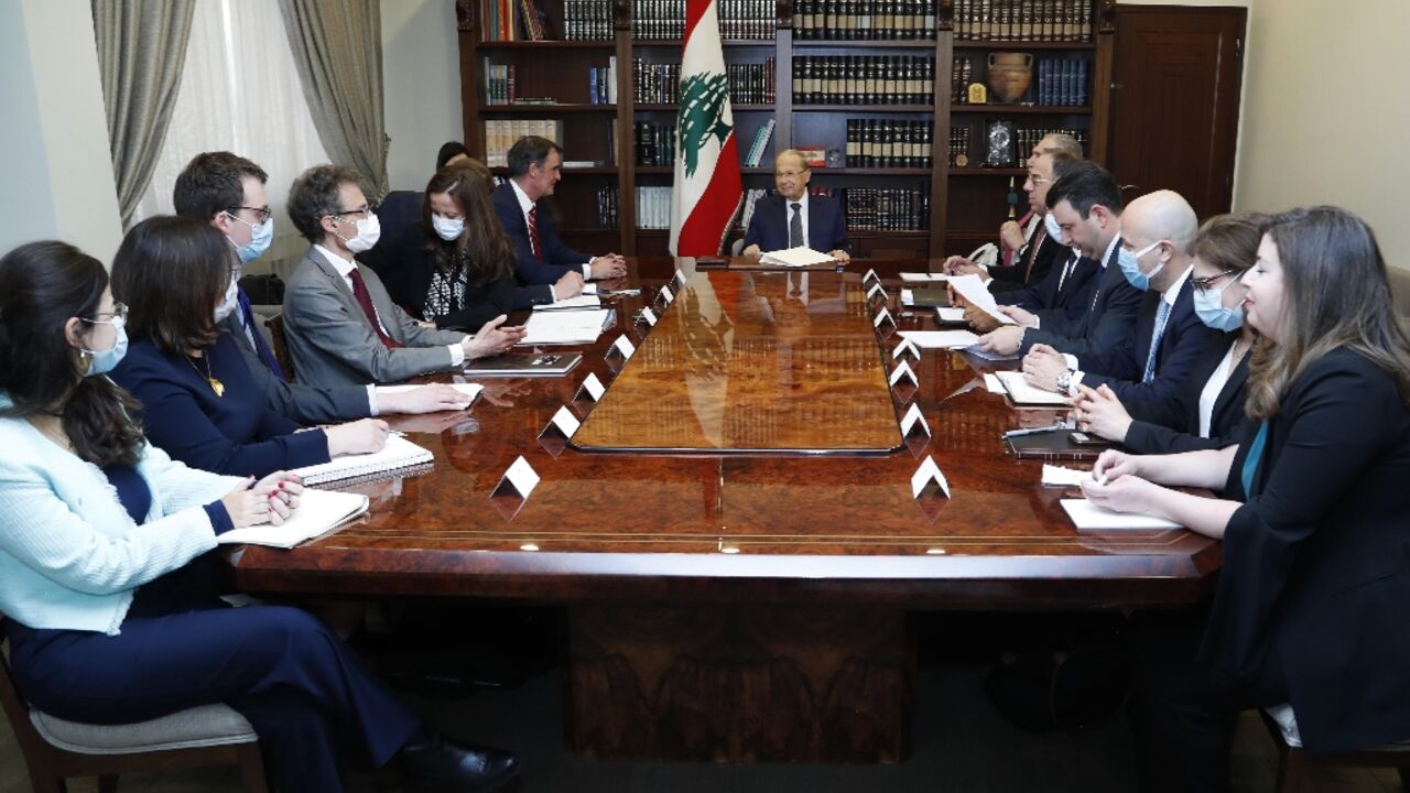 Lebanon's President Michel Aoun meets the International Monetary Fund (IMF) delegion at the presidential palace in Baabda, east of the capital Beirut, on March 30, 2022 Lebanon's President Michel Aoun meets the International Monetary Fund (IMF) delegion at the presidential palace in Baabda, east of the capital Beirut, on March 30, 2022
