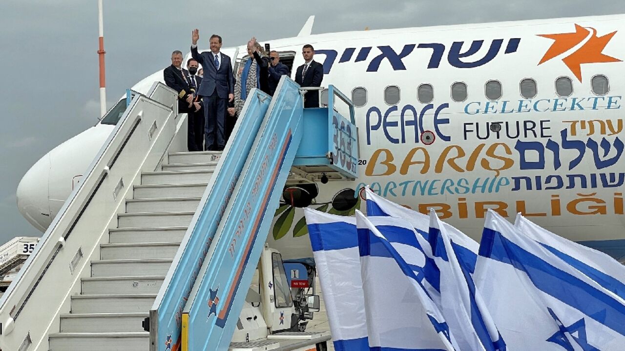 Israel's President Isaac Herzog waves as he departs for an official visit to Turkey, as the countries seek to mend fractured ties