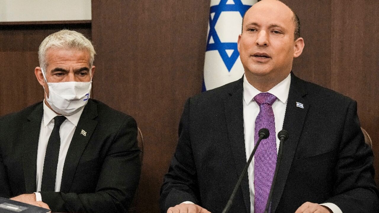 Israeli Prime Minister Naftali Bennett and Foreign Minister Yair Lapid at a cabinet meeting last month