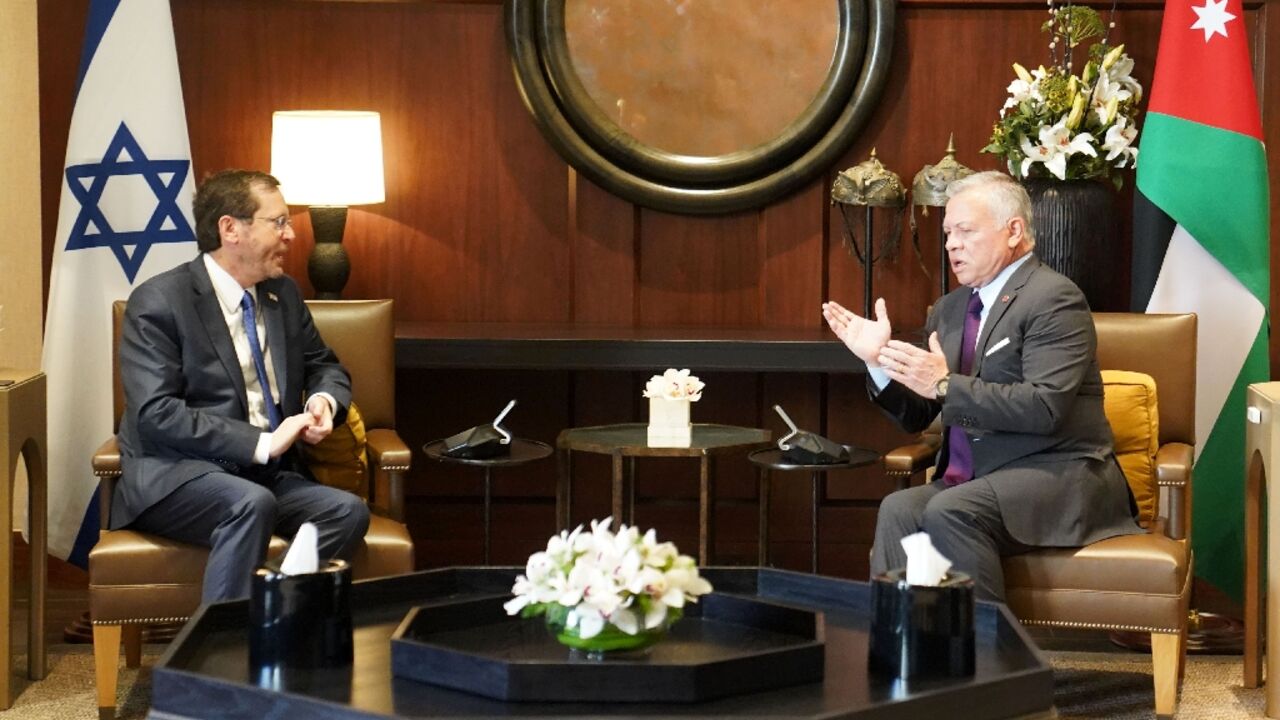 A handout picture released by the Jordanian Royal Palace shows Jordan's King Abdullah II and Israeli President Isaac Herzog talking during a meeting in the capital Amman A handout picture released by the Jordanian Royal Palace shows Jordan's King Abdullah II and Israeli President Isaac Herzog talking during a meeting in the capital Amman