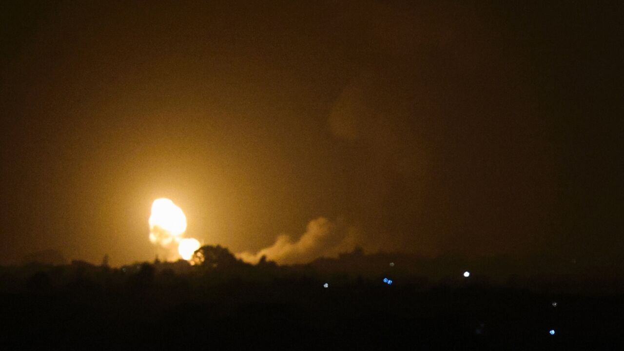 Flames and smoke rise over the Gaza Strip town of Rafah after Israel carries out its first air strikes on the territory in months