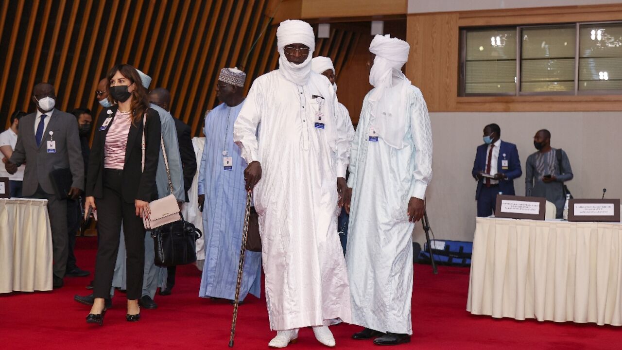 Participants arrive for the start of the Chad peace negotiations in Qatar's capital Doha, on March 13, 2022