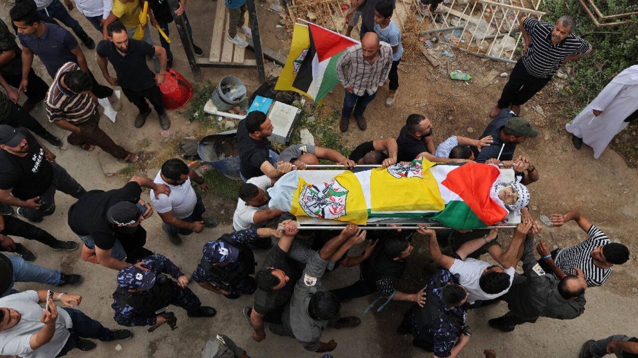 Palestinians carry the body of Ahmed Ibrahim Oweidat, killed during an operation by Israeli forces in the occupied West Bank Palestinians carry the body of Ahmed Ibrahim Oweidat, killed during an operation by Israeli forces in the occupied West Bank