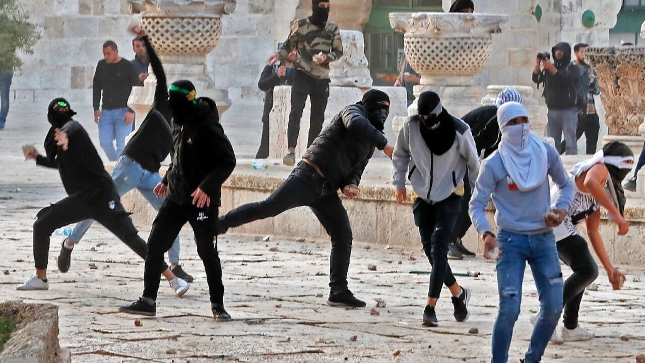 Palestinian demonstrators clash with Israeli police at Jerusalem's Al-Aqsa mosque compound after the morning prayers in east Jerusalem Palestinian demonstrators clash with Israeli police at Jerusalem's Al-Aqsa mosque compound after the morning prayers in east Jerusalem