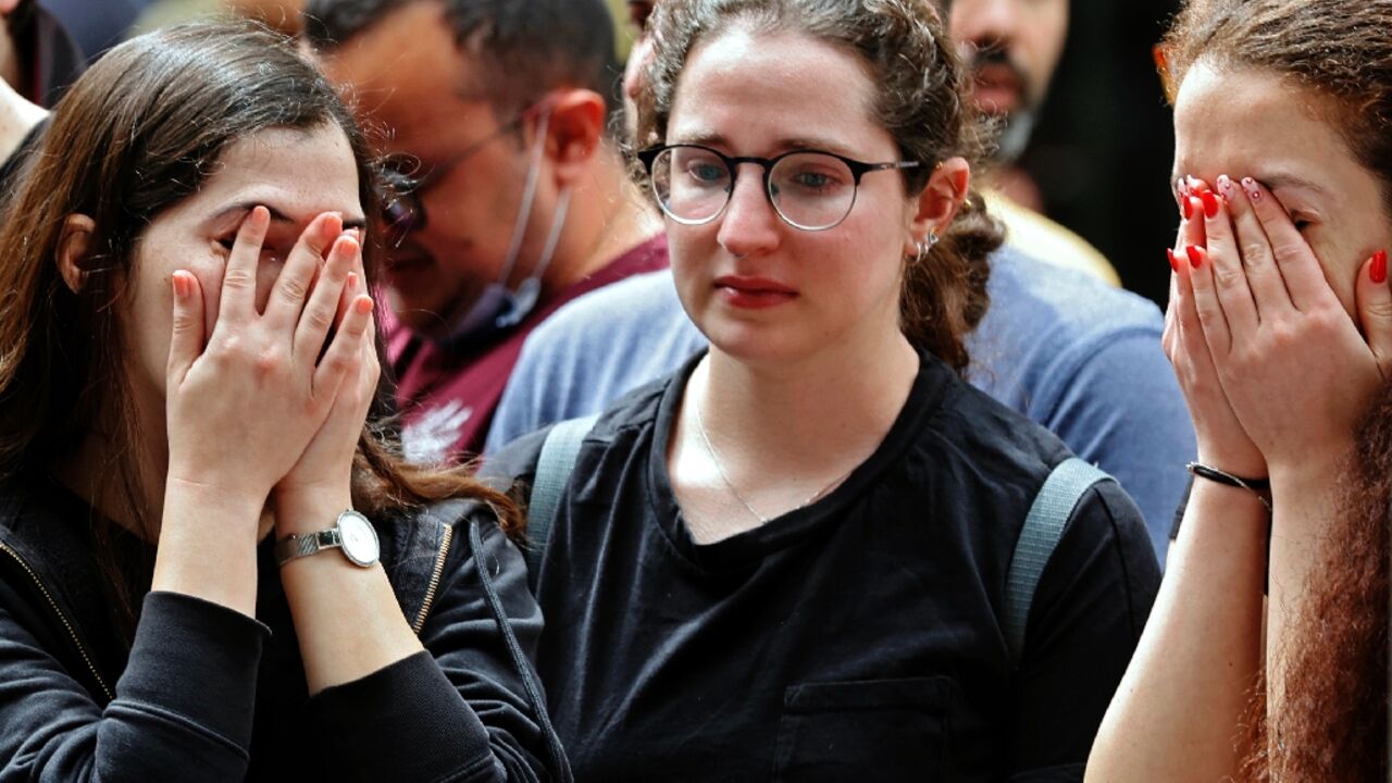 Israelis react at the site of a shooting attack the previous night on Dizengoff Street in the centre of Israel's Mediterranean coastal city of Tel Aviv Israelis react at the site of a shooting attack the previous night on Dizengoff Street in the centre of Israel's Mediterranean coastal city of Tel Aviv