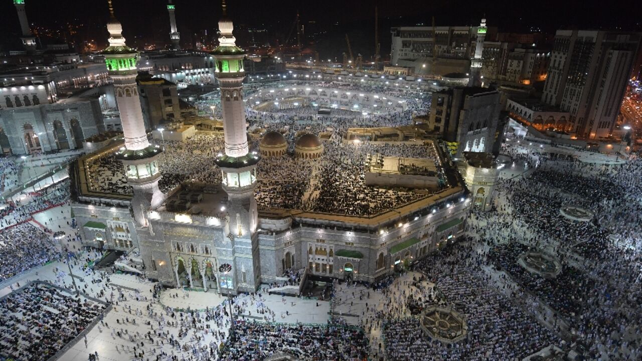 Pilgrims gather at the Grand Mosque in Saudi Arabia's holy city of Mecca on August 7, 2019: Saudi said it will dramatically increase numbers for the hajj in 2022