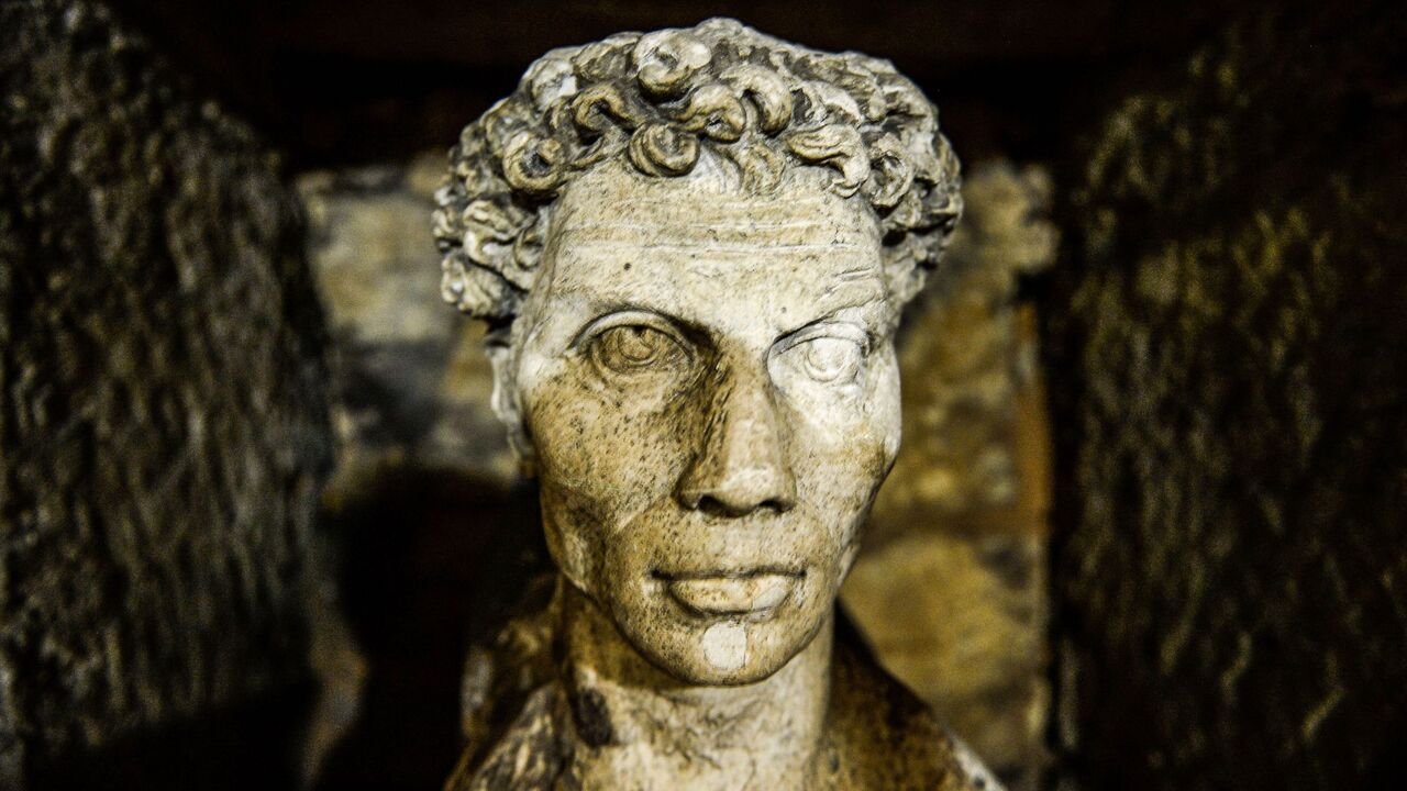 This picture taken on March 3, 2019, shows a view of a statue inside the catacombs of Kom El-Shoqafa (Mound of Shards).