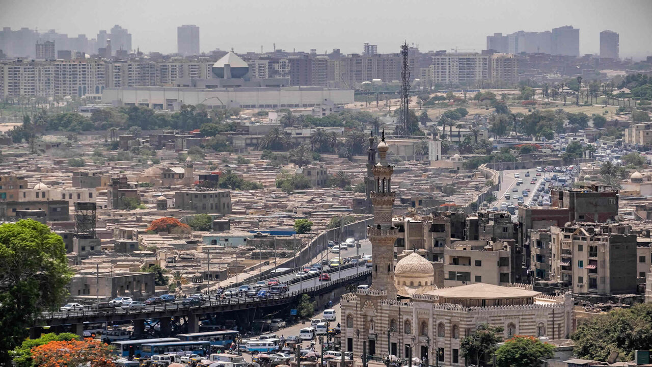 The Cairo Citadel is seen with in the foreground the 14th-century Sayyida Aisha Mosque and shrine and in the background the new National Museum of Egyptian Civilization, Cairo, Egypt, May 26, 2021.