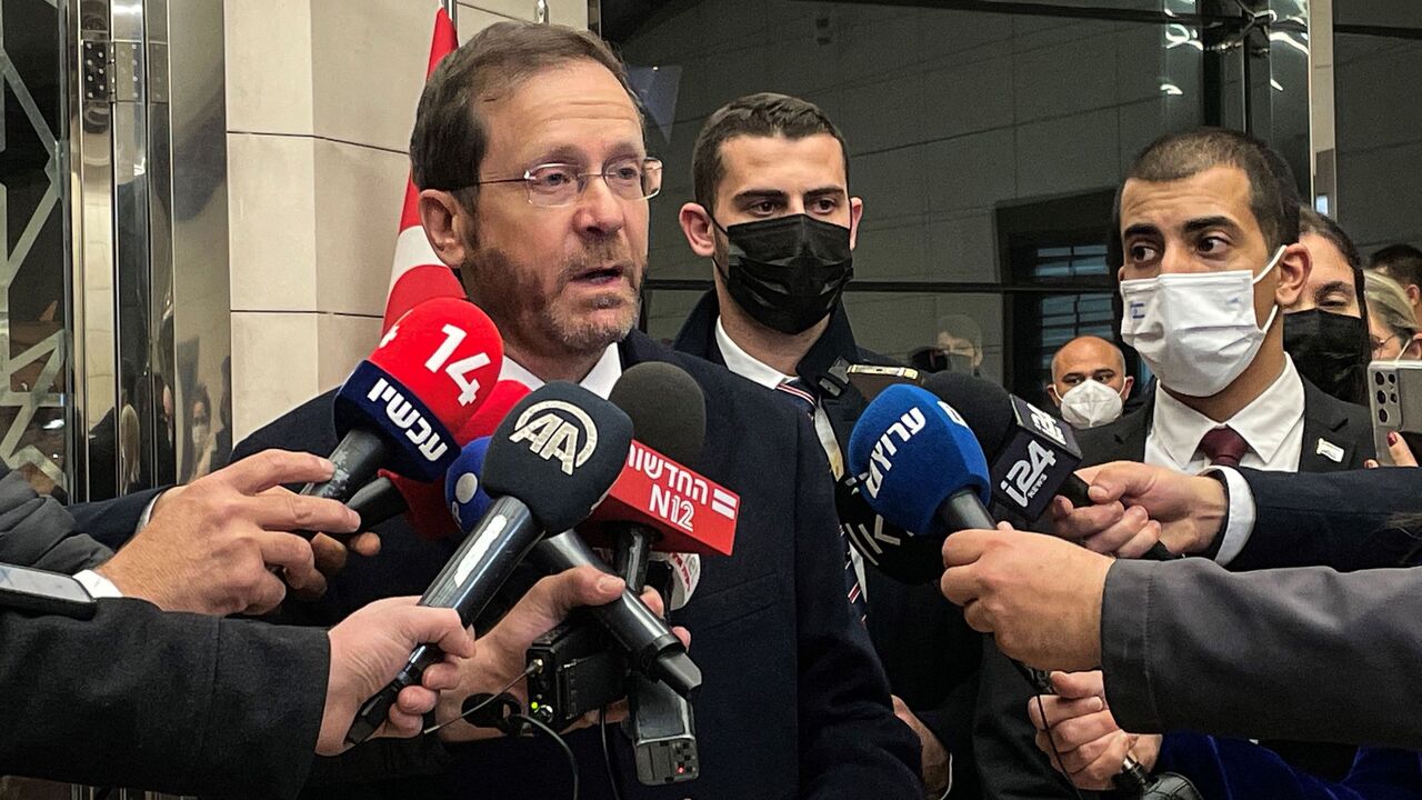 Israeli President Isaac Herzog speaks to press at the Ankara airport.