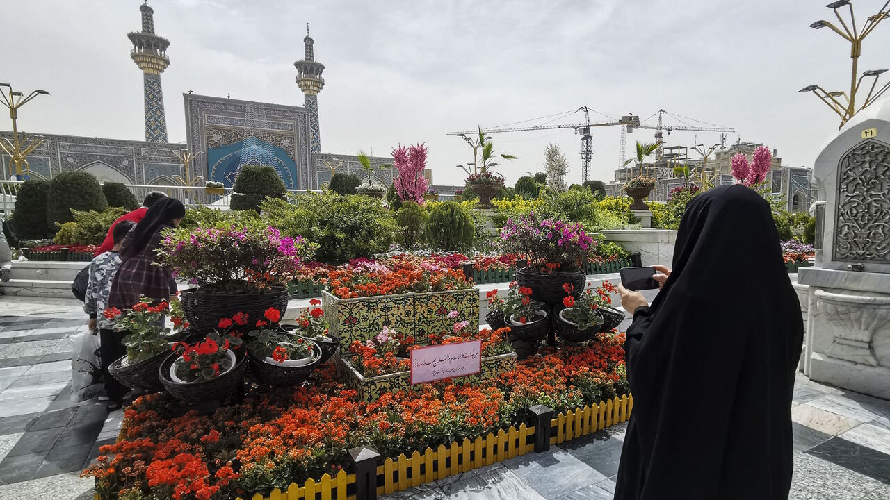 Iranians visit the spot in the courtyard of Imam Reza shrine in the northeastern city of Mashhad on April 6, 2022, where a day earlier a Muslim cleric was killed.