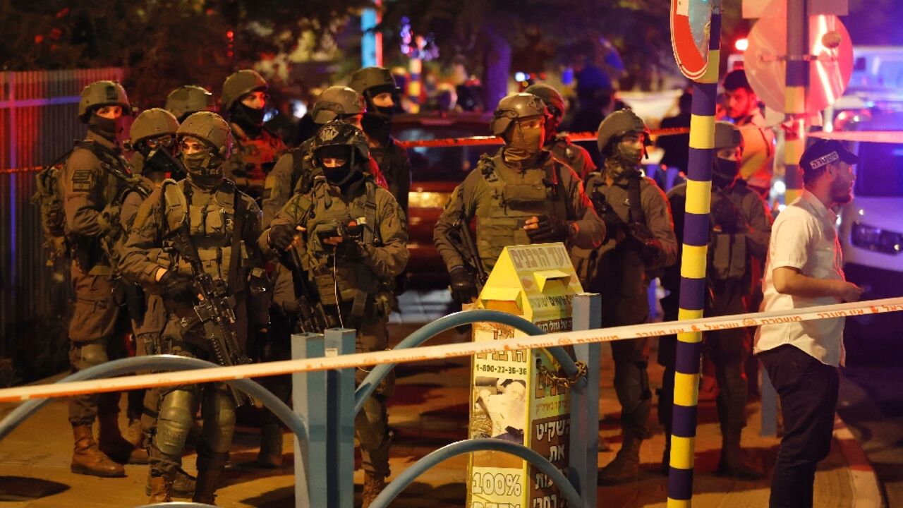 Israeli security forces are pictured at the scene of an attack in the central city of Elad on May 5 Israeli security forces are pictured at the scene of an attack in the central city of Elad on May 5