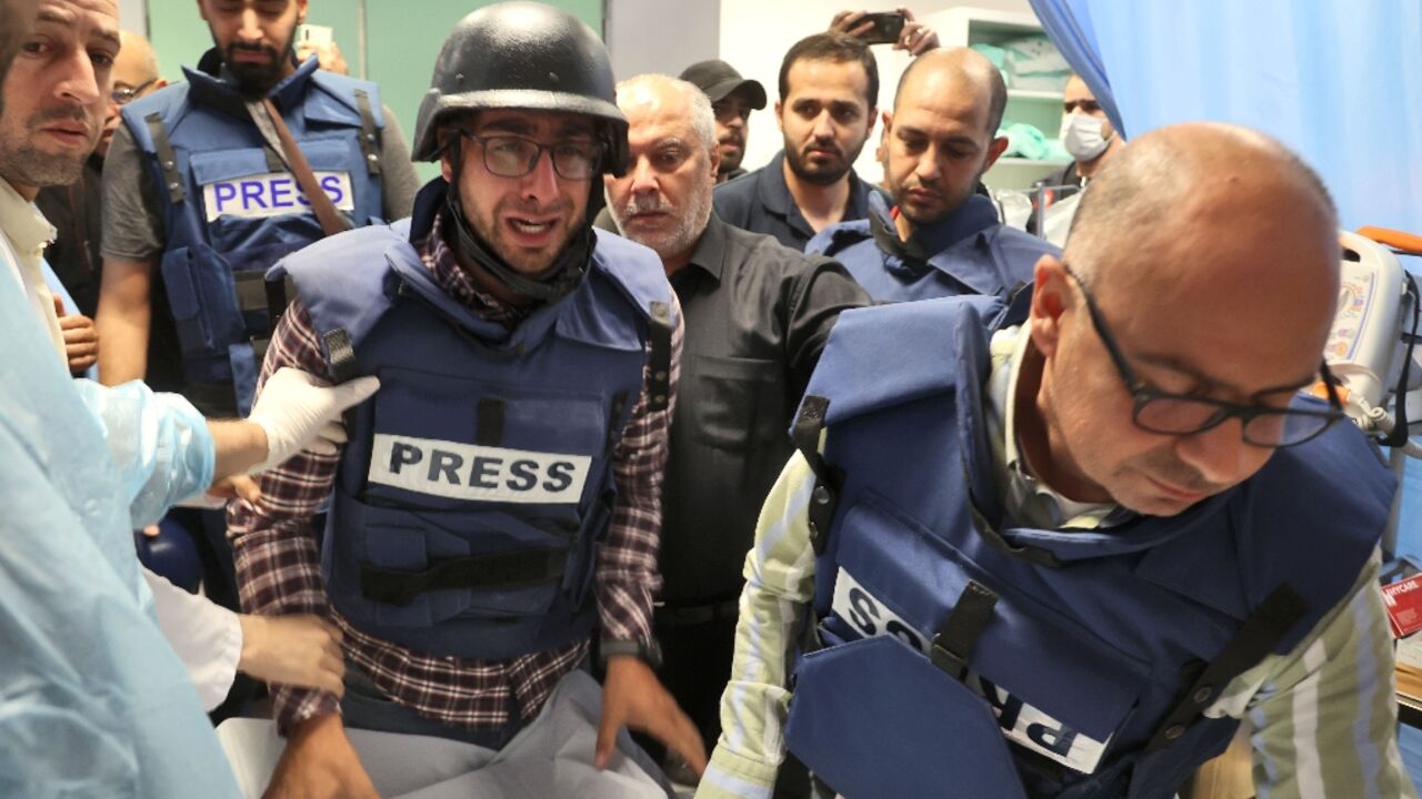 Journalists escort the body of veteran Al Jazeera reporter Shireen Abu Aqleh, who  was shot dead by Israeli troops as she covered a raid on Jenin refugee camp in the occupied West Bank