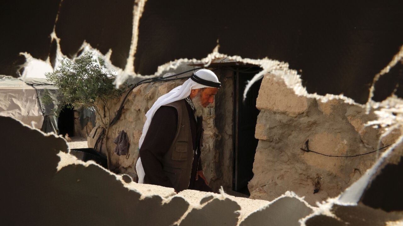 Ali Mohammed Jabbareen, 60, walks at the Palestinian village of Jinba, part of the Masafer Yatta area in the Israeli-occupied West Bank Ali Mohammed Jabbareen, 60, walks at the Palestinian village of Jinba, part of the Masafer Yatta area in the Israeli-occupied West Bank