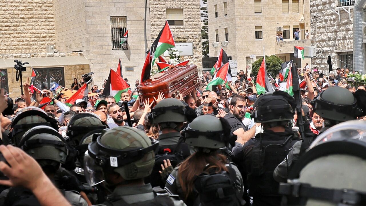 Israeli security forces move in on Palestinian mourners carrying the coffin of slain Al Jazeera journalist Shireen Abu Akleh Israeli security forces move in on Palestinian mourners carrying the coffin of slain Al Jazeera journalist Shireen Abu Akleh