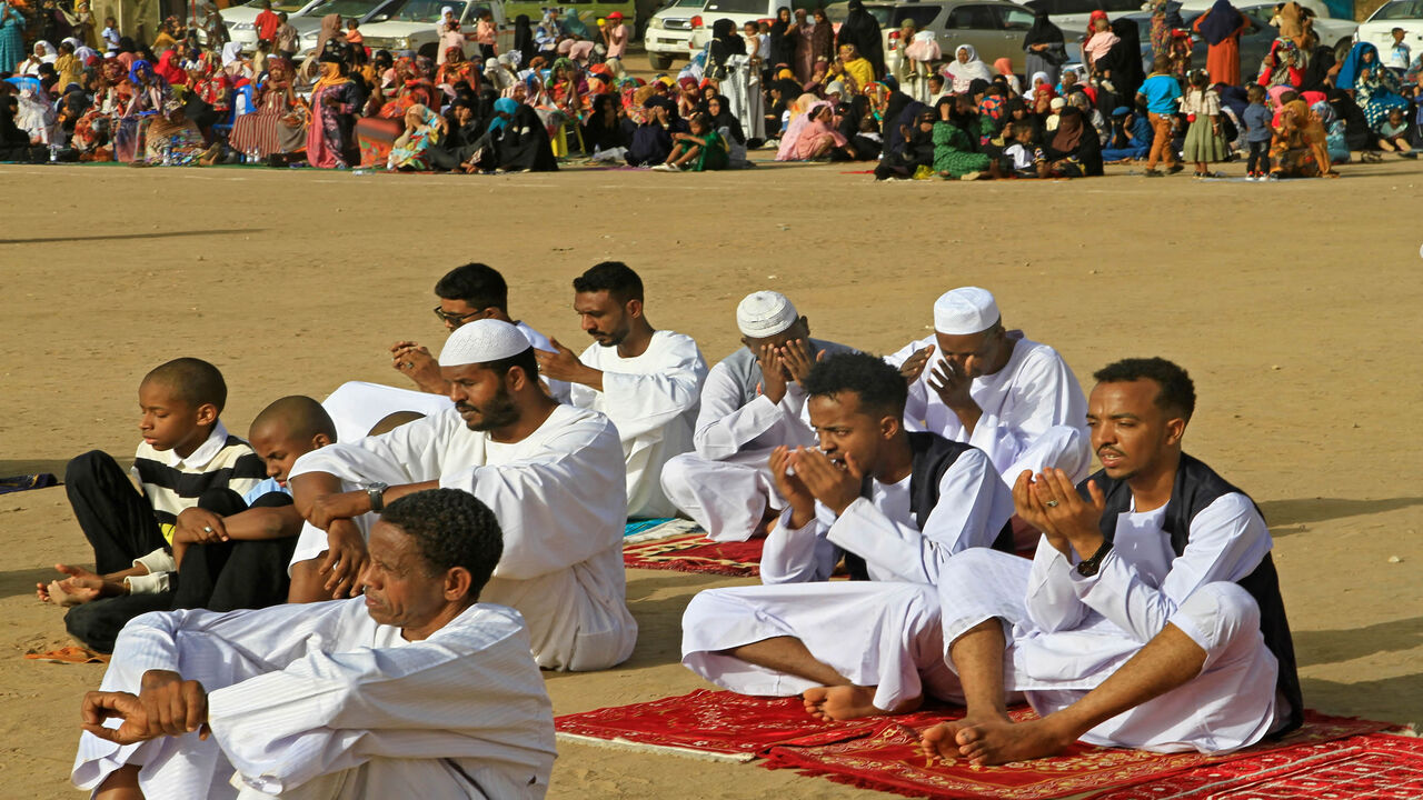 Muslim devotees pray on the first day of Eid al-Fitr, which marks the end of the holy month of Ramadan, in al-Jarif suburb, Khartoum, Sudan, May 2, 2022.