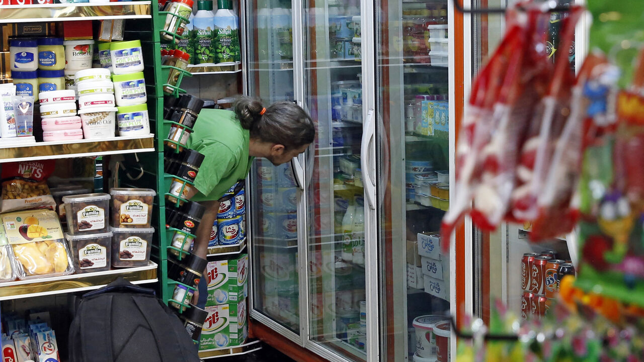 An Iranian shops at a food store in Tehran on May 13, 2021.