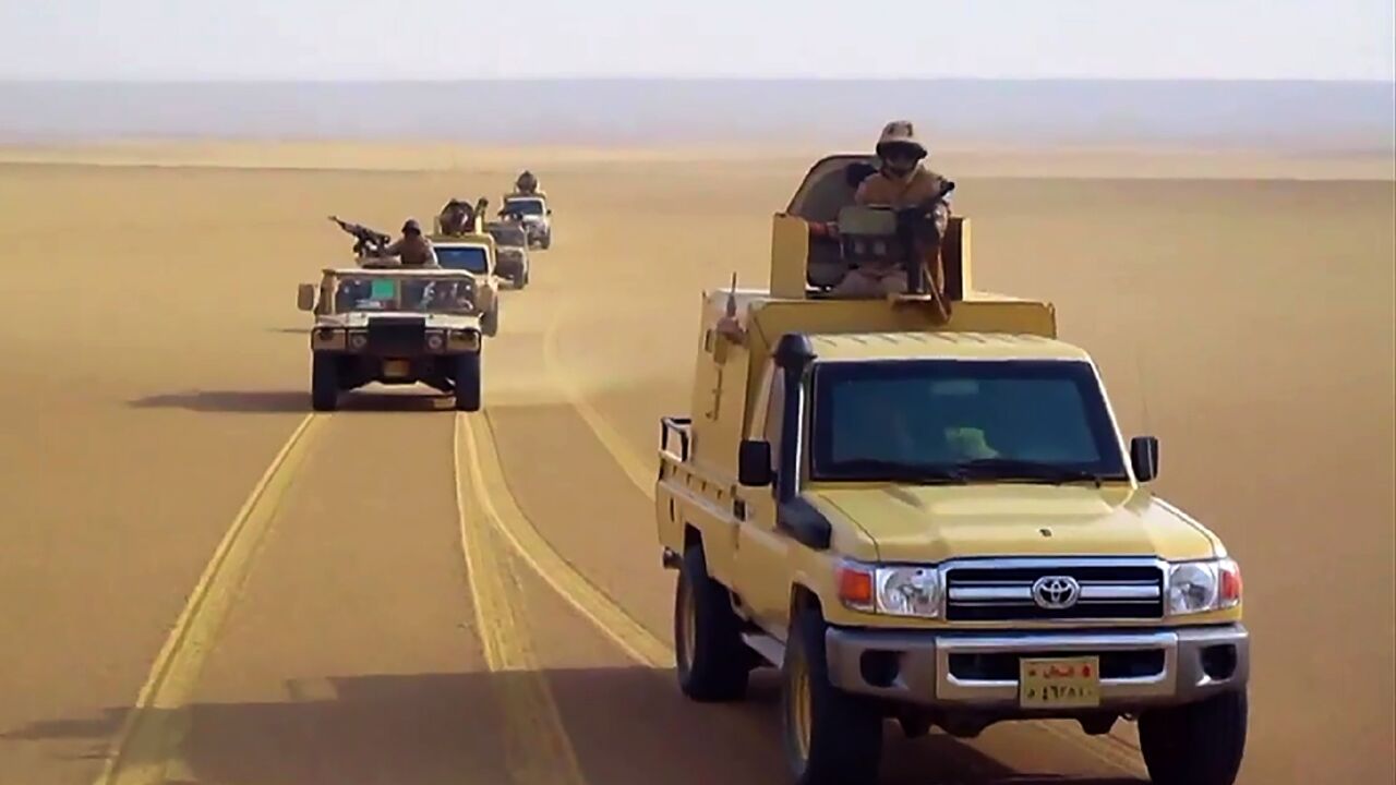 An image grab taken from a handout video released by the official Facebook page of Egypt's Military Spokesman on December 8, 2020 shows an Egyptian army trucks in the desert