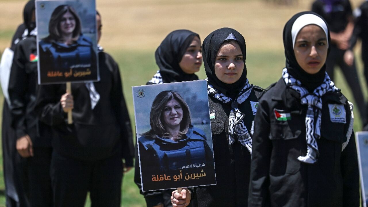 Palestinian youths hold a mock funeral for slain Al Jazeera reporter Shireen Abu Akleh in Gaza City on May 17, 2022 Palestinian youths hold a mock funeral for slain Al Jazeera reporter Shireen Abu Akleh in Gaza City on May 17, 2022