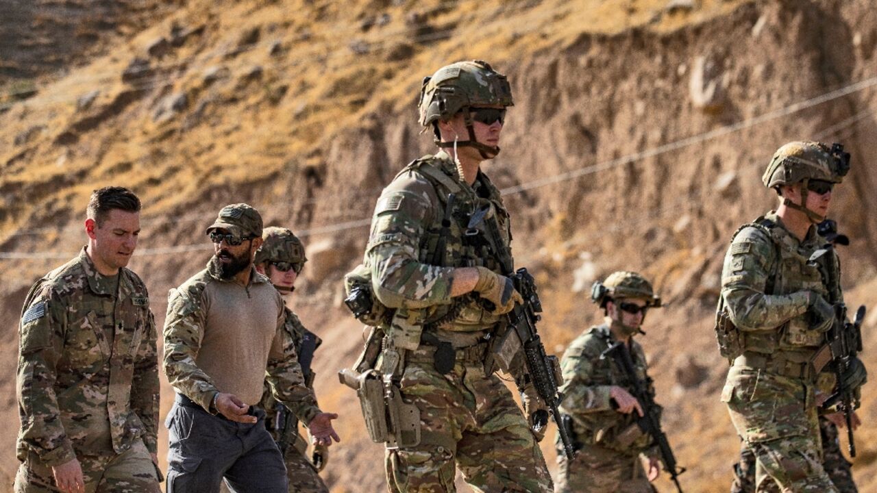 US soldiers patrol an area near Syria's northeastern Semalka border crossing with Iraq's Kurdish autonomous territory, on November 1, 2021