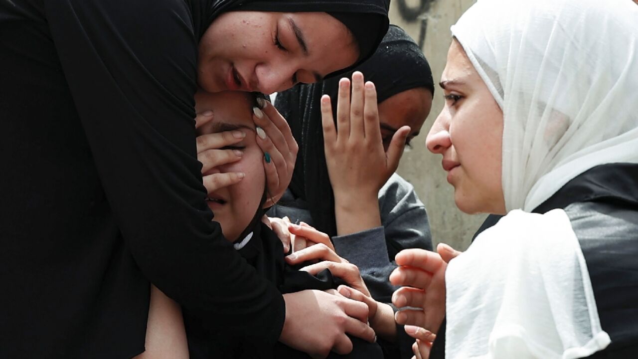 The sisters of 17-year-old Palestinian Amjad al-Fayed killed in clashes during an Israeli army raid in Jenin on the occupied West Bank mourn his death