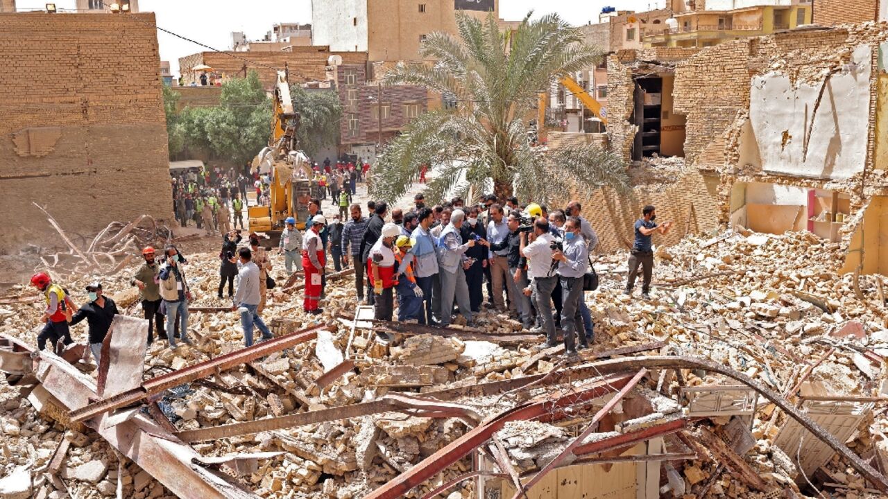 Iranian vice president Mohammad Mokhber tours the site of the tower block collapse which killed at least 26 people in the southwestern city of Abadan