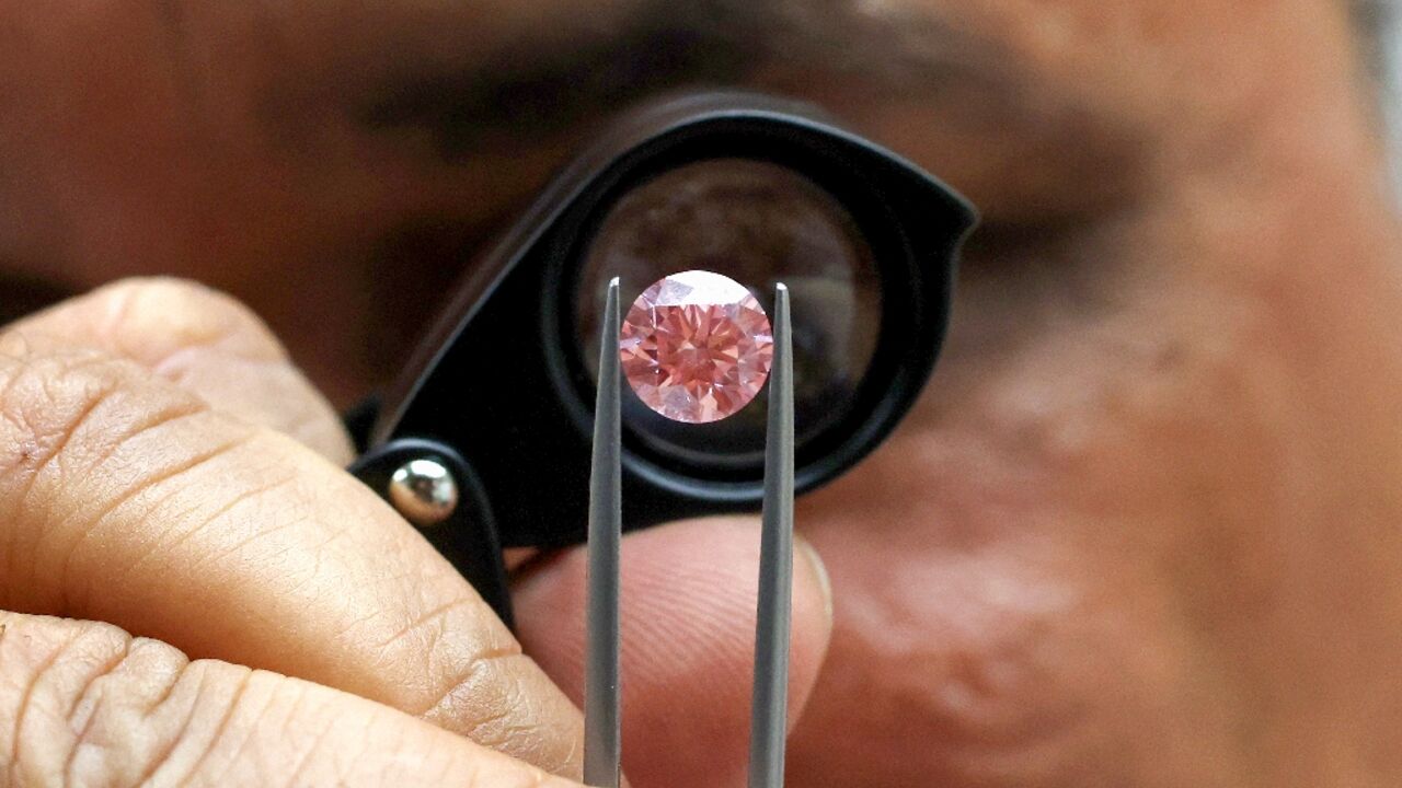 Pravin Kukadia, who moved to Israel in 2003 to develop his diamond business, displays a diamond Pravin Kukadia, who moved to Israel in 2003 to develop his diamond business, displays a diamond