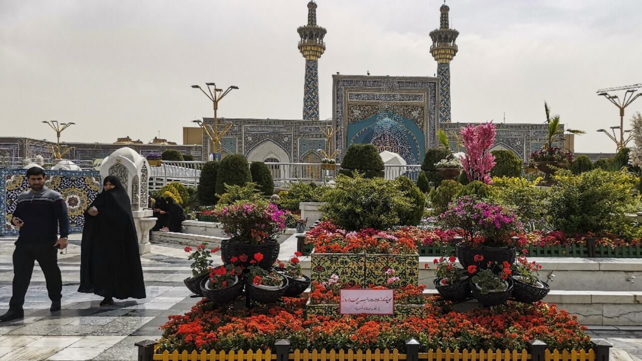 Iranians visit the spot in the courtyard of Imam Reza shrine in Mashhad city on April 6, 2022, where a day earlier an attacker stabbed three clerics, two of them fatally