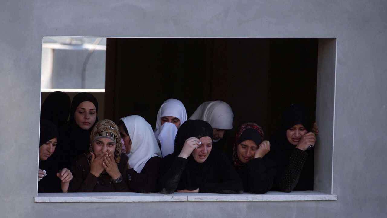 Palestinian women mourn the death of Hamas movement activist Fadi Hamadneh who died inside a Palestinian Authority prison.