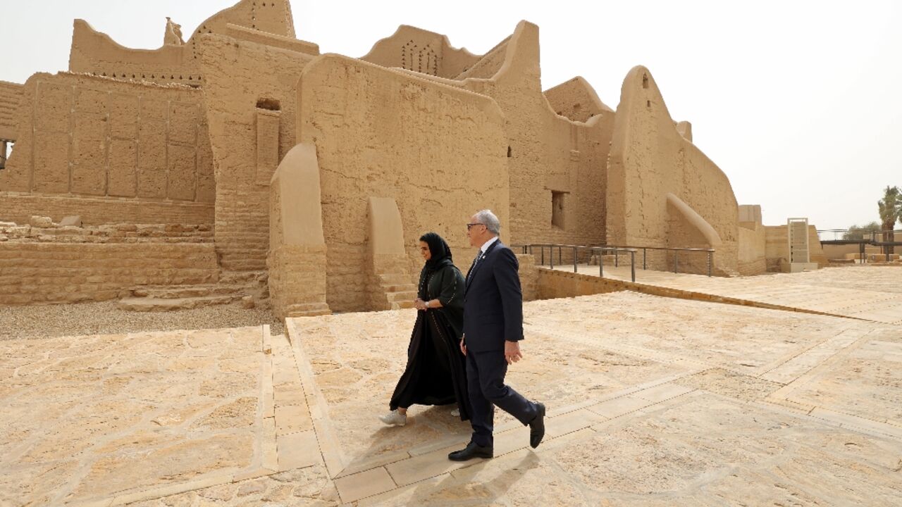Saudi tour guide Nada Alfuraih walks in the historic district of Diriyah with Jerry Inzerillo, a Brooklyn entertainment executive who says heritage and entertainment are "highly compatible" Saudi tour guide Nada Alfuraih walks in the historic district of Diriyah with Jerry Inzerillo, a Brooklyn entertainment executive who says heritage and entertainment are "highly compatible"