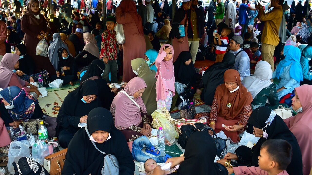 People gather to see off their relatives en-route to Mecca in Saudi Arabia for the annual Hajj pilgrimage, from the Narathiwat provincial airport in southern Thailand on June 10, 2022 People gather to see off their relatives en-route to Mecca in Saudi Arabia for the annual Hajj pilgrimage, from the Narathiwat provincial airport in southern Thailand on June 10, 2022