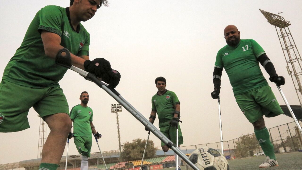 Members of the Iraqi national football team for amputees take part in a training session at Al-Shaab stadium in Baghdad Members of the Iraqi national football team for amputees take part in a training session at Al-Shaab stadium in Baghdad