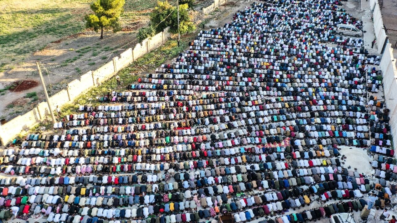 Muslim morning prayers in the rebel-held northwestern Syrian city of Idlib at the start of the Eid al-Adha holidays