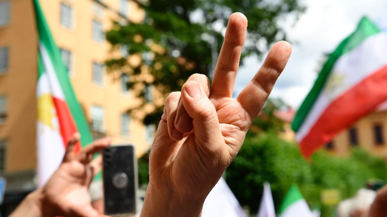 Protesters cheered and waved flags outside the courthouse after the verdict Thursday 