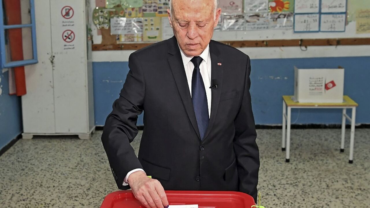 President Kais Saied votes in a referendum on a draft constitution he put forward, at a polling station in the capital Tunis