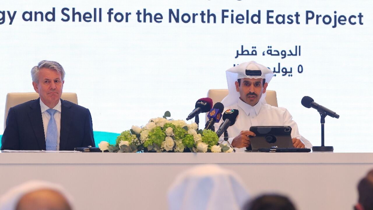 Qatar's Minister of State for Energy Saad Sherida al-Kaabi (R) and Shell's CEO Ben van Beurden hold a signing ceremony at QatarEnergy headquarters in Doha on July 5