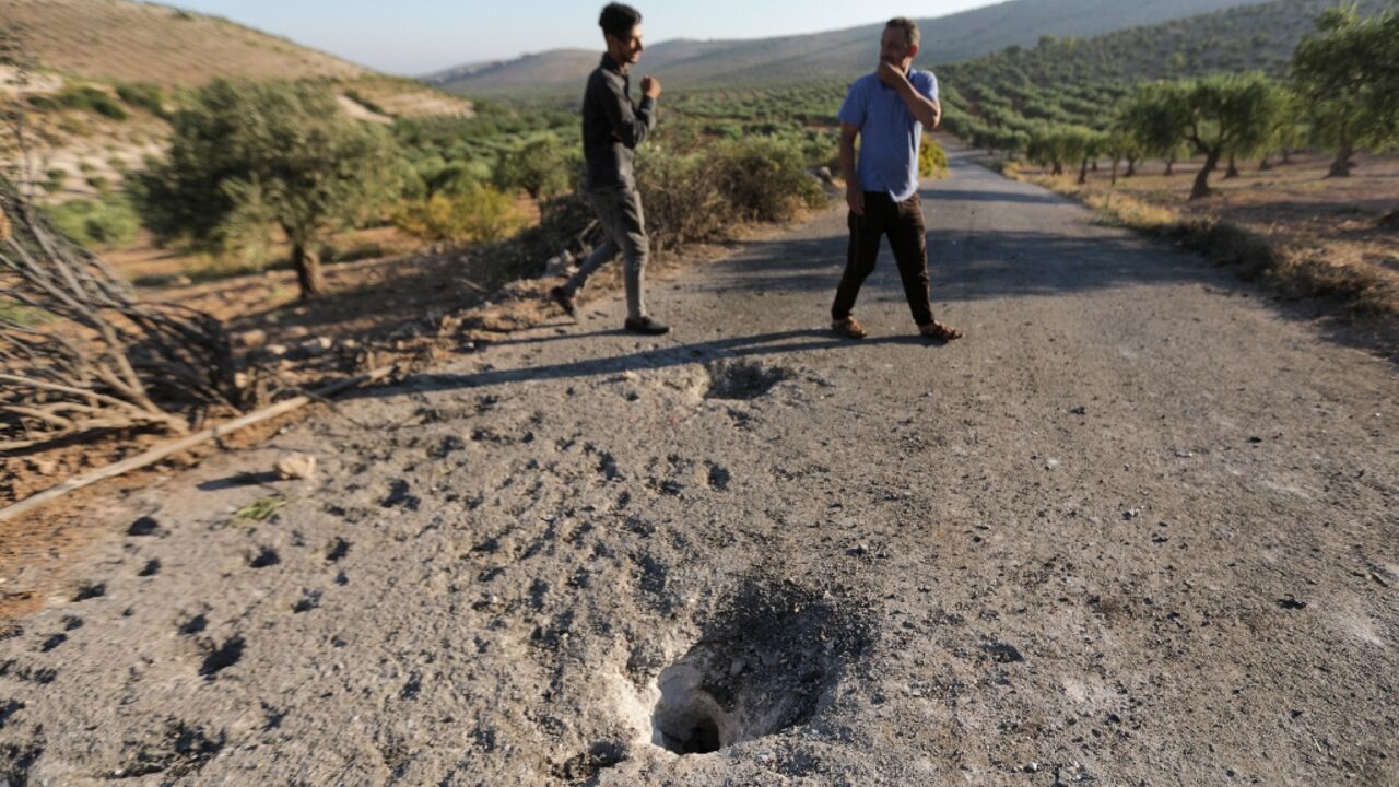 People inspect the site where a US drone targeted killed Maher al-Agal, a leader in the Islamic State militant group near Jindires in northern Syria. People inspect the site where a US drone targeted killed Maher al-Agal, a leader in the Islamic State militant group near Jindires in northern Syria.