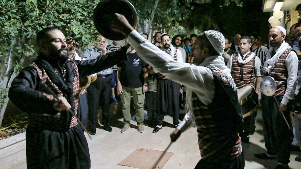 Syrian "Arada" folklore dancers of the "Bab al-Hara" troupe perform while in traditional dress