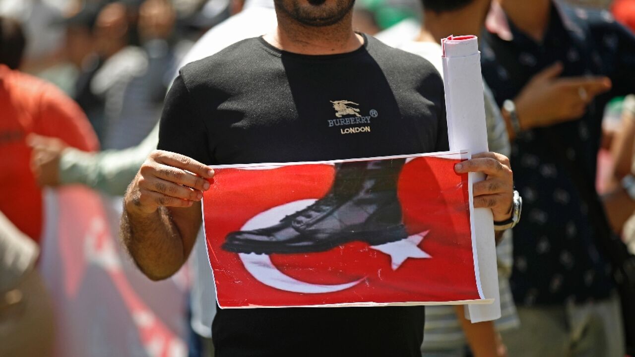 An Iraqi takes part in a demonstration in Baghdad against an attack on the country's autonomous Kurdistan region blamed on Turkey An Iraqi takes part in a demonstration in Baghdad against an attack on the country's autonomous Kurdistan region blamed on Turkey