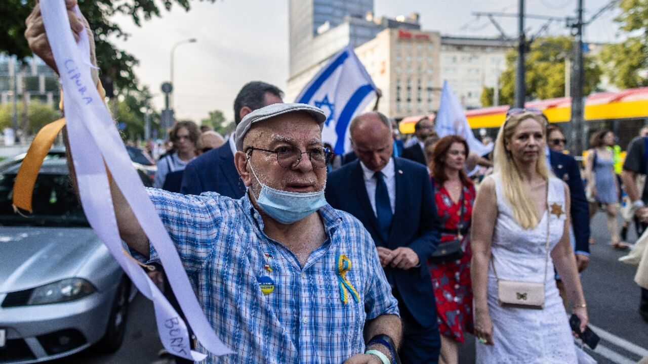 The procession passed through the location where Jews were deported from the ghetto to the Treblinka extermination camp The procession passed through the location where Jews were deported from the ghetto to the Treblinka extermination camp