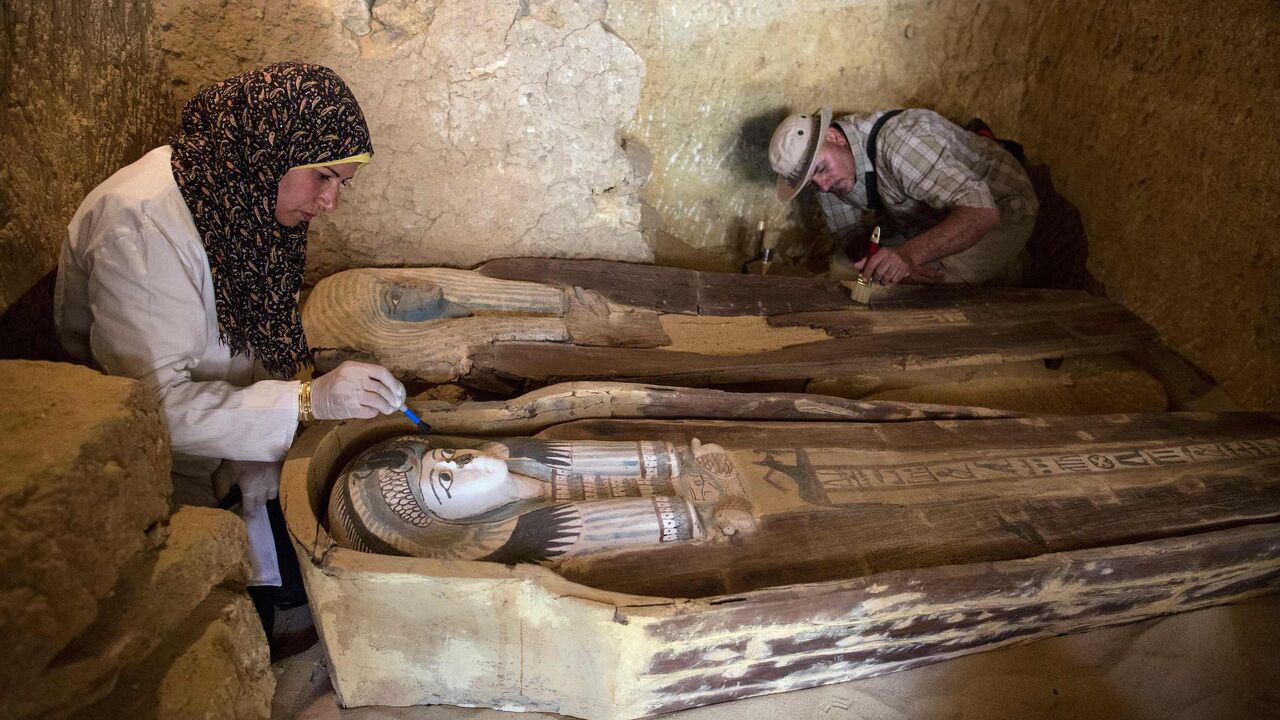 Excavation workers work inside a burial shaft at the Giza pyramid plateau, on the southwestern outskirts of Cairo.