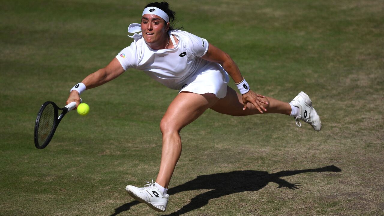 Tunisia's Ons Jabeur returns the ball to Kazakhstan's Elena Rybakina during their women's singles final tennis match on the thirteenth day of the 2022 Wimbledon Championships at The All England Tennis Club in Wimbledon, southwest London, on July 9, 2022.