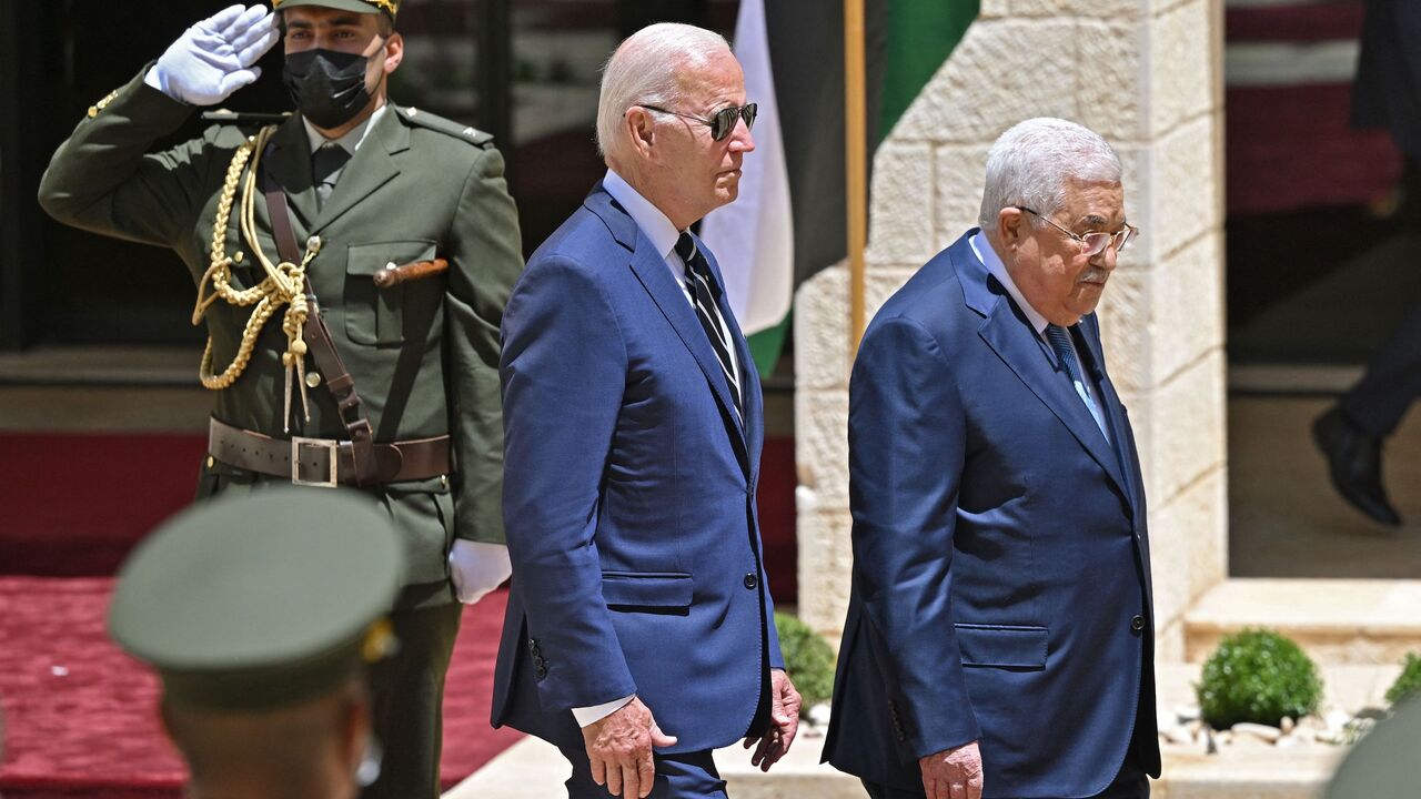 US President Joe Biden (C) is received by Palestinian president Mahmud Abbas (R) during a welcome ceremony at the Palestinian Muqataa Presidential Compound in the city of Bethlehem in the occupied West Bank on July 15, 2022.