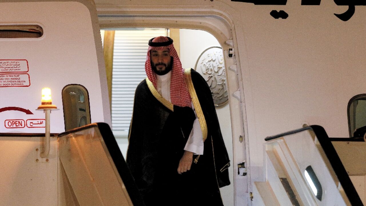 Saudi Crown Prince Mohammed bin Salman disembarks off his aircraft upon arrival at Queen Alia International Airport on the southern outskirts of Jordan's capital Amman on June 21, 2022 Saudi Crown Prince Mohammed bin Salman disembarks off his aircraft upon arrival at Queen Alia International Airport on the southern outskirts of Jordan's capital Amman on June 21, 2022