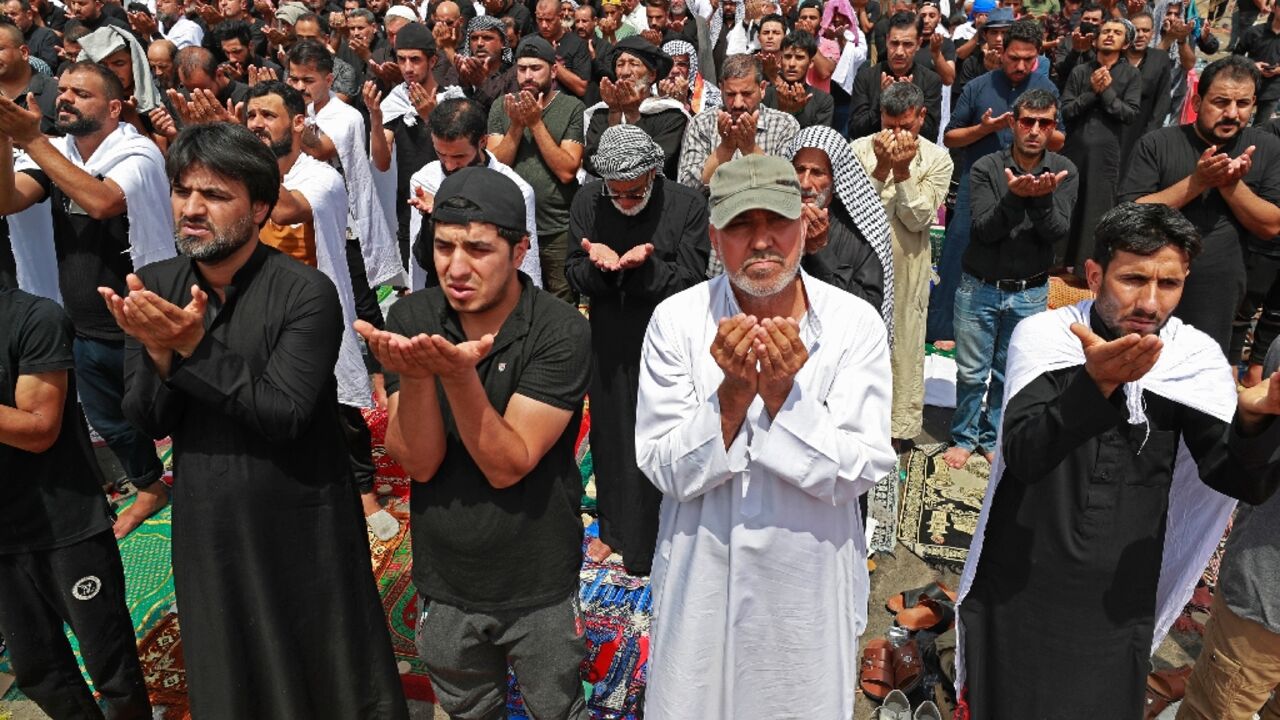 Supporters of Iraqi Shiite cleric Moqtada Sadr gather for the weekly Friday prayers during their vigil outside parliament in the capital Baghdad